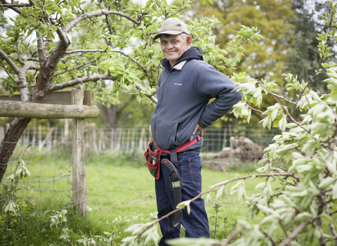 Martin stands in a garden